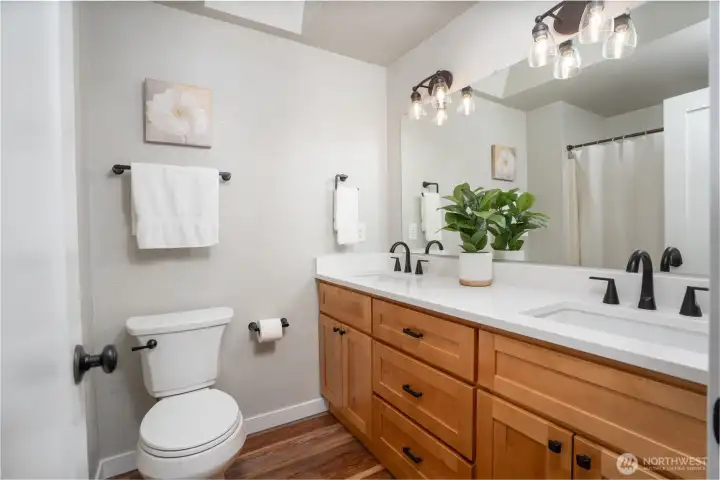 Main/full bathroom has been nicely updated with a new double vanity with quartz top; lav sinks & faucets plus new lighting.