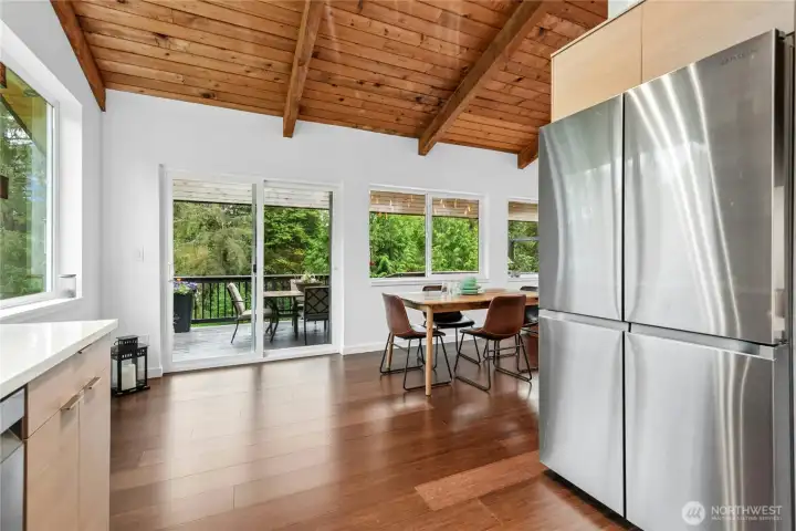 Large sliding glass door leads to outside deck!
