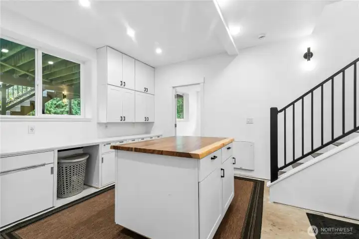 Desk area in laundry room overlooking backyard. (Automatic generator in back of home)