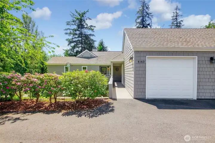 1-car garage with lots of storage and pull down ladder. Plenty of guest parking. Great landscaping surrounds unit.