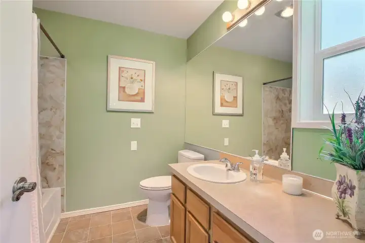 Primary full bath with window.