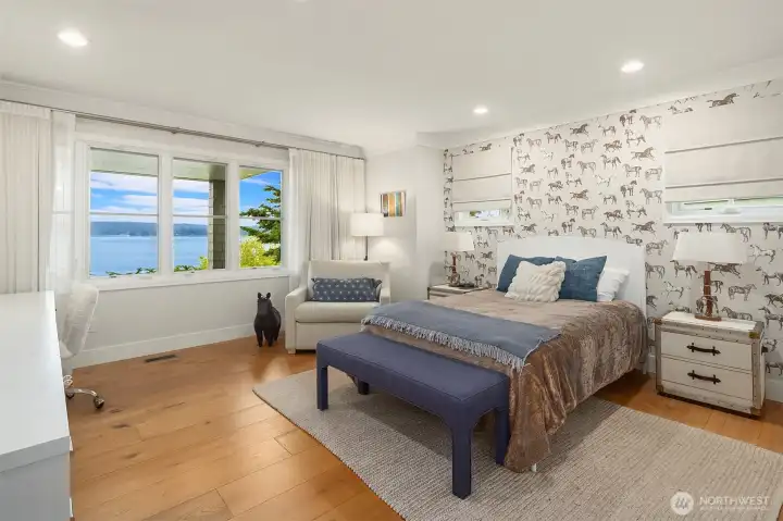 Spacious lower level bedroom enjoys views.