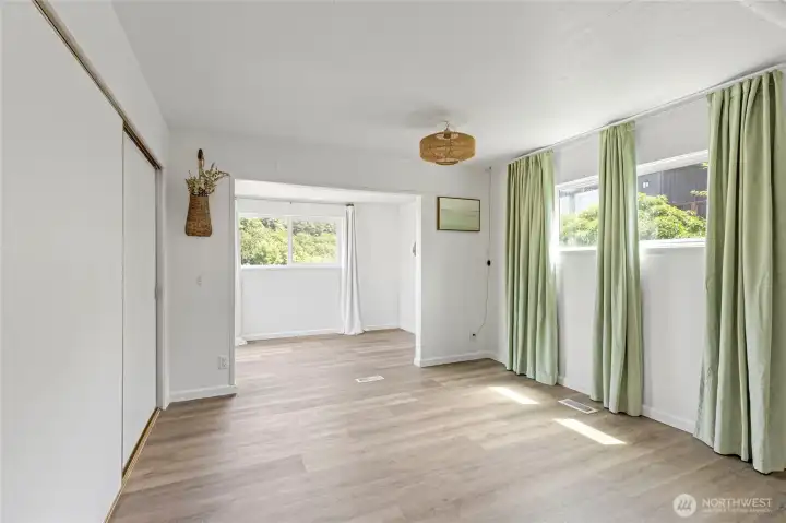 Primary bedroom and flex space with water view.