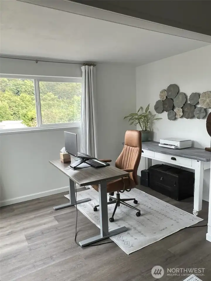 Flex space with previous furnishings shown to help visualize room scale and design possibilities.