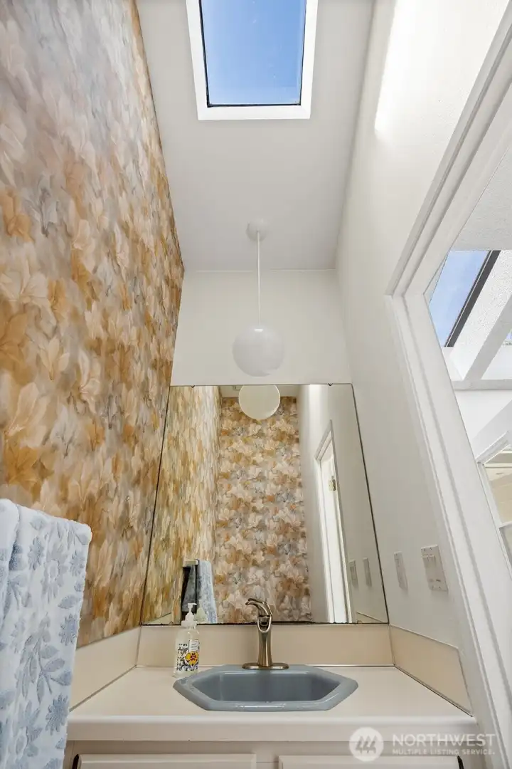 Guest Half bath in main level entry Guest Half bath in main level entry
