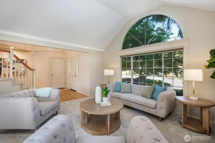 Flush floor with refinished hardwood floors; new carpet & open rail staircase view