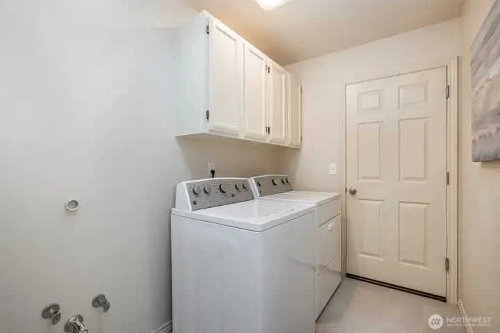 Laundry room w/ new vinyl floor + plumbed for utility sink