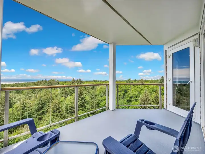 Relax and unwind while enjoying sweeping coastal views from your private covered deck.