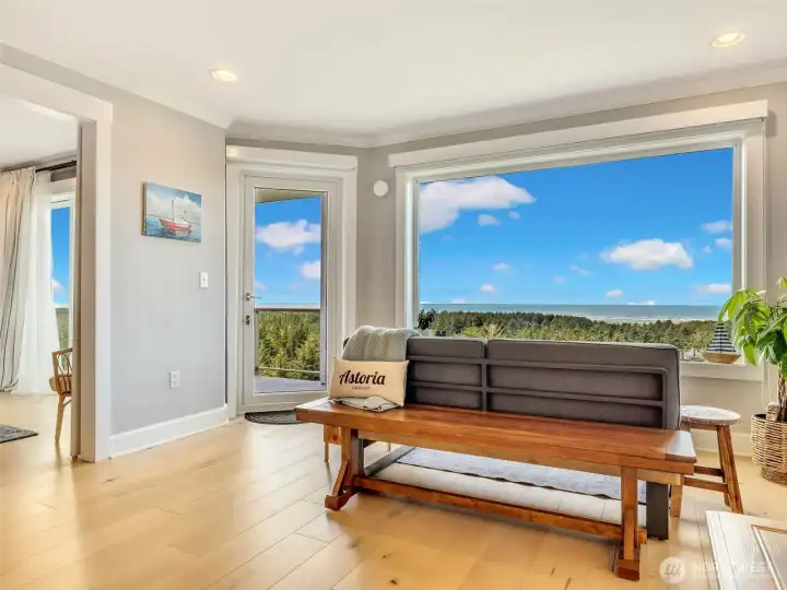 Additional sitting area offers the perfect place to enjoy morning coffee while taking in the ocean views.