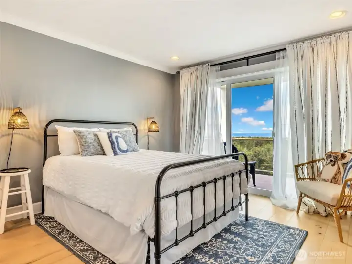 Wake up to beautiful peninsula scenery from the comfort of the primary bedroom.