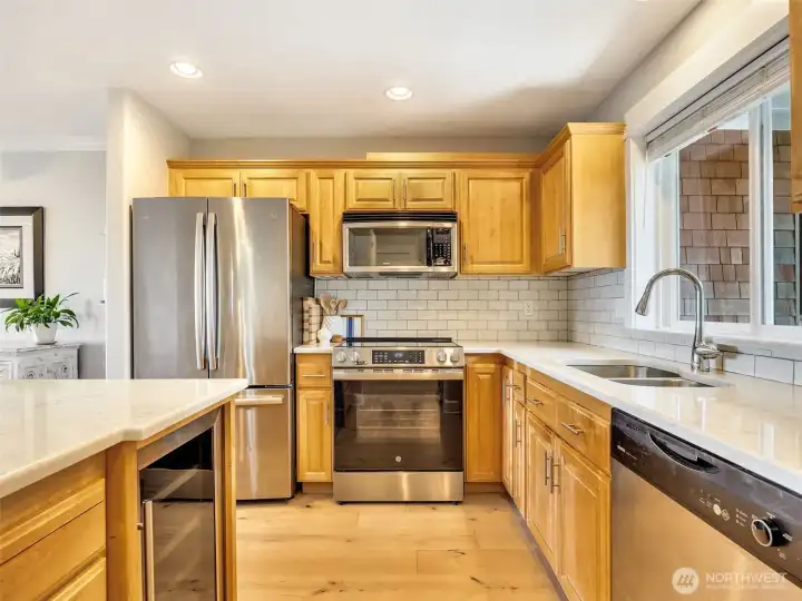 Bright kitchen with granite countertops, abundant cabinetry, and an efficient layout for entertaining.