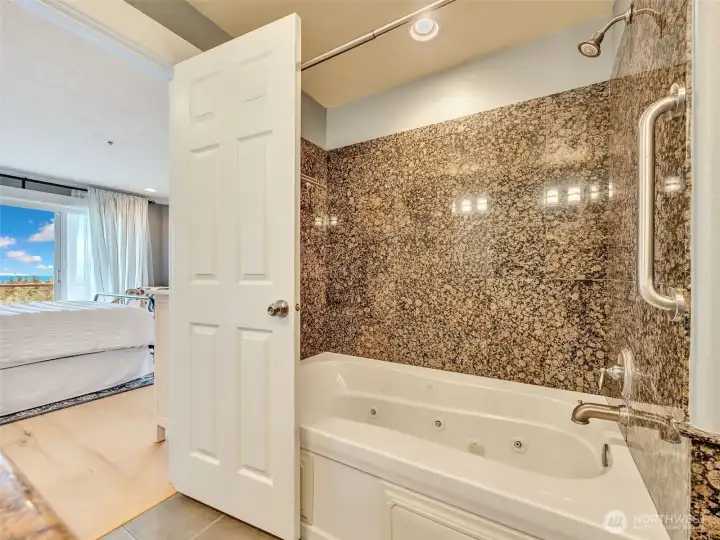 Spacious ensuite with soaking tub, separate shower, and quality finishes throughout.