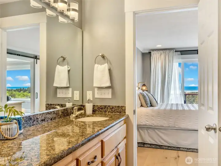 Well-appointed primary bath designed for comfort with dual sinks and ample counter space.