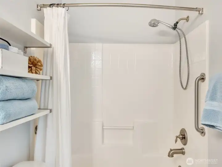 Clean, well-maintained guest bath with additional storage and functional design for everyday living or weekend getaways.