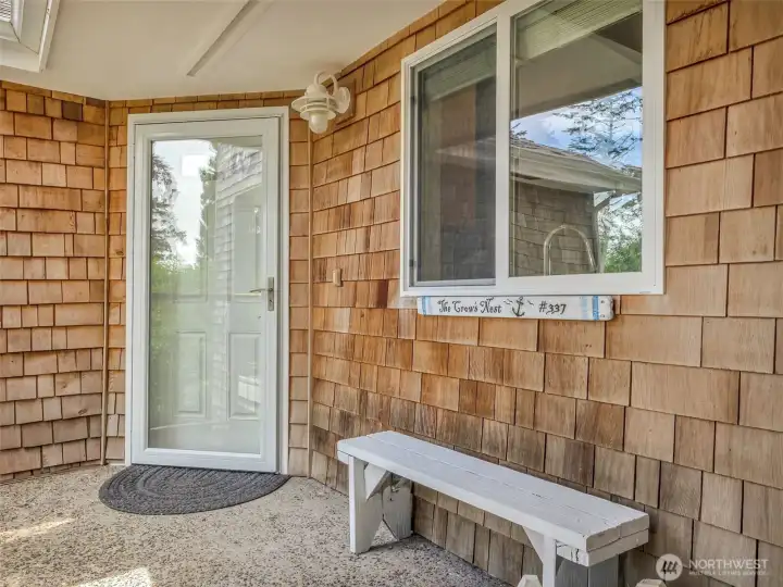 Welcoming private entry with coastal charm and easy access to this beautifully maintained condo.