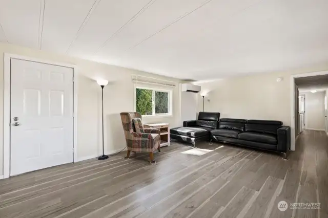 Open floor living room and entry door