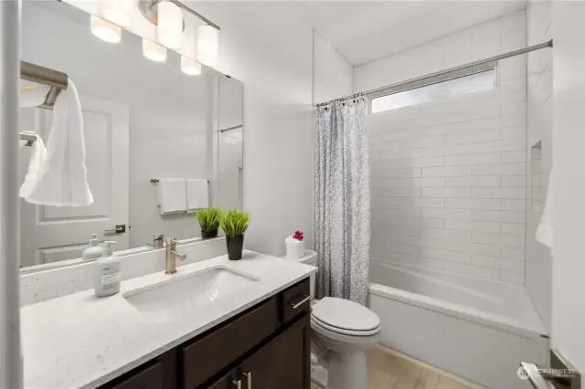 Guest bathroom located next to guest bedroom in the front of the home.