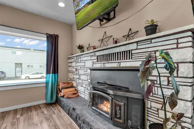 Living room with woodstove insert, natural lighting!