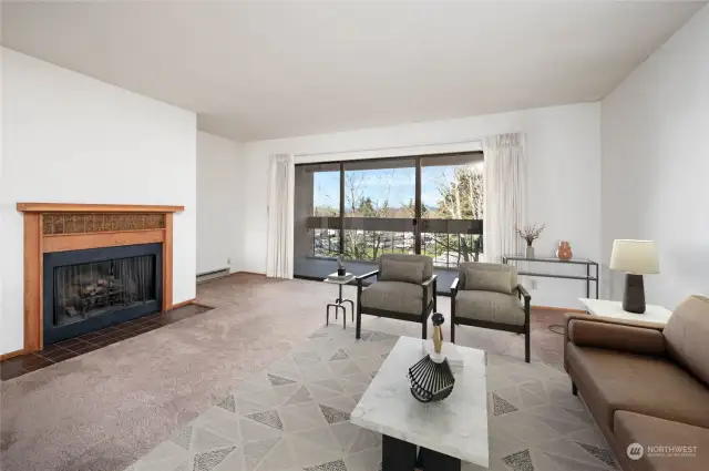 Living room area with fireplace. Virtually staged