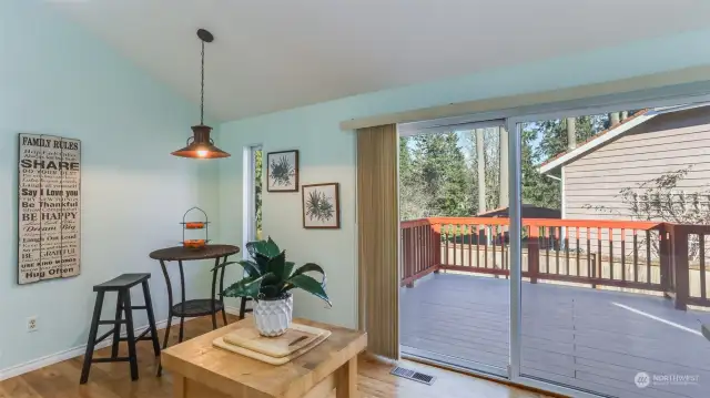 This view from inside the home provides a glimpse of the outdoor deck, seamlessly connecting indoor and outdoor spaces.