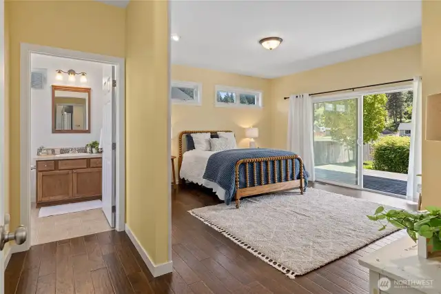 Spacious master bedroom features a walk-in closet and private bath access.