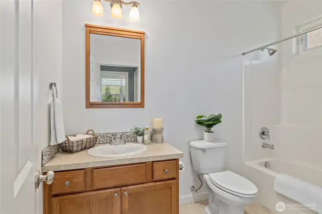 A fresh and welcoming guest bathroom that makes every visitor feel right at home.