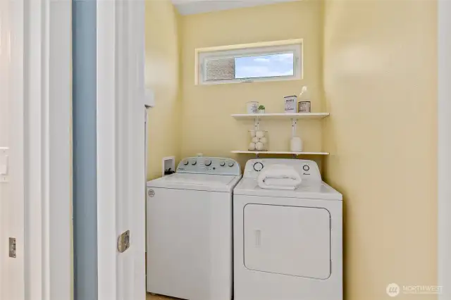 Convenient and spacious laundry room located just off the kitchen for easy access.