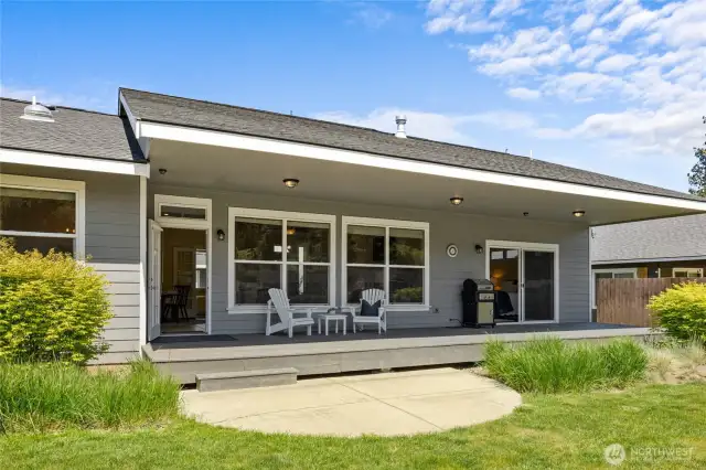 Spacious back porch overlooking 75 feet of serene waterfront—perfect for morning coffee or sunset sunsets.