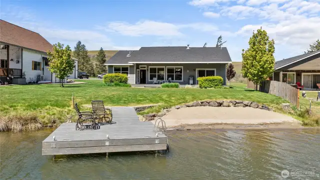 Relax in a backyard featuring stunning 75-foot waterfront views and your own private dock.