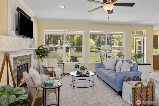 This living room offers a serene escape with natural lighting, comfortable seating, and a welcoming fireplace. It’s the perfect place to curl up with a book or enjoy intimate conversations with family and friends.