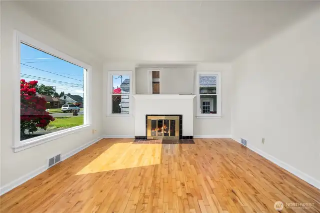 Amazing light flows throughout the living room with tons of windows.    (fire was digitally placed in all photos)
