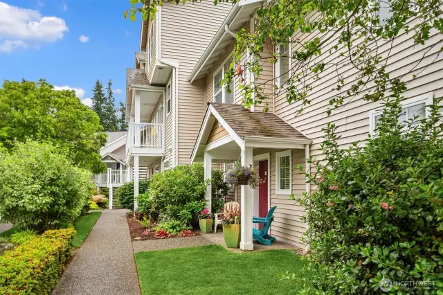This home is extra special and is tucked away in a private corner with gorgeous surroundings! The grounds leading to your sweet corner, end unit are shown here. Nantucket at Harbour Pointe is well manicured, with no rental cap and no pet restrictions!