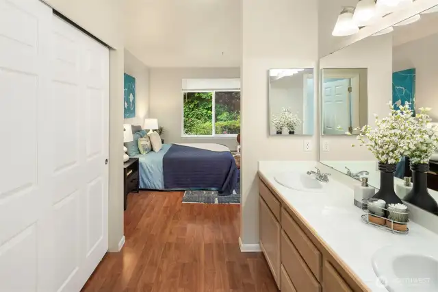 The en suite three quarter bathroom offers extra closet space and two sinks.