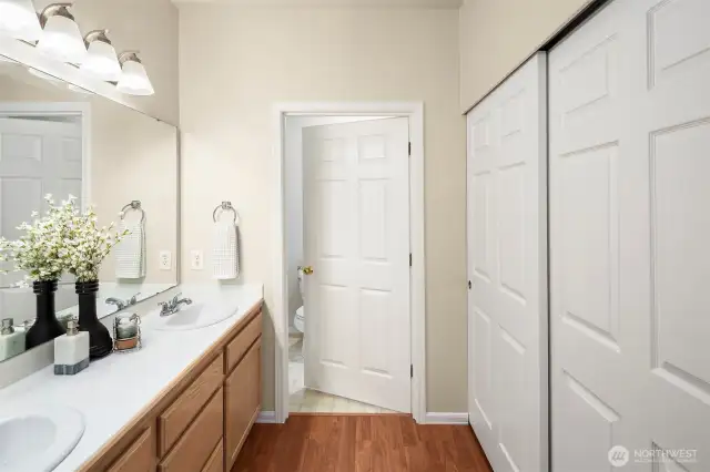 On the right is the additional closet space, through the door is the rest of the primary bathroom.