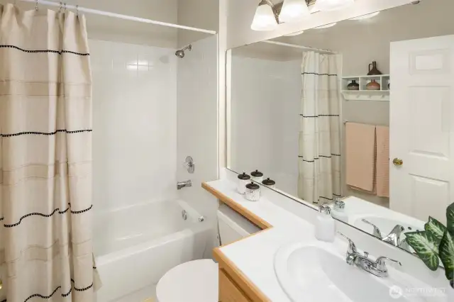 A full bathroom sits in the hallway adjacent to the second and third bedrooms, great to keep any guests out of your primary bathroom.