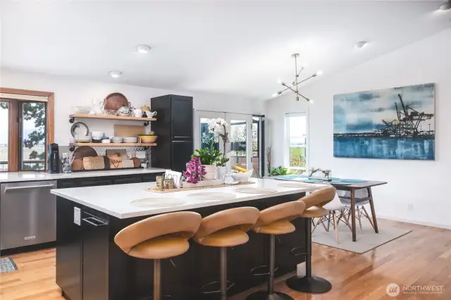 Another view of the kitchen and dining areas.