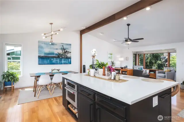 Wonderful open living space with wood floors, vaulted ceilings, perfect for entertaining.