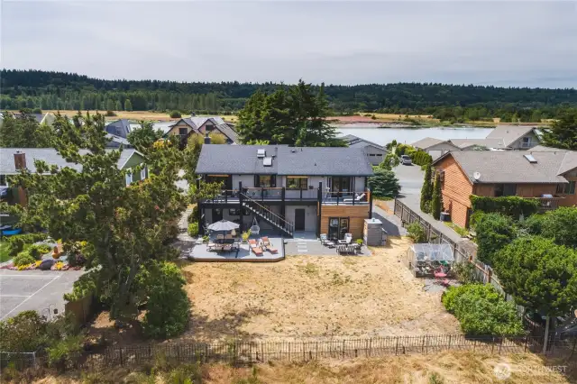 Back of the home and spacious backyard.