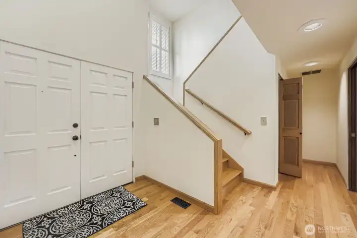 An inviting front entry with soaring ceilings and abundant light.
