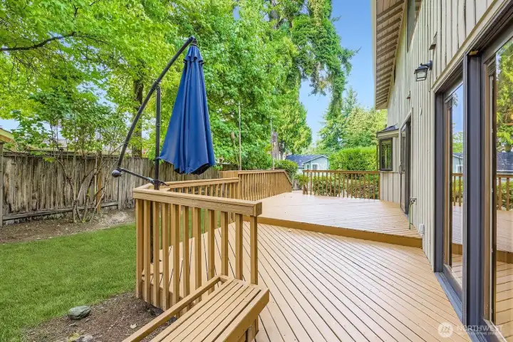 Another view of the deck and back of the home with a built-in bench.