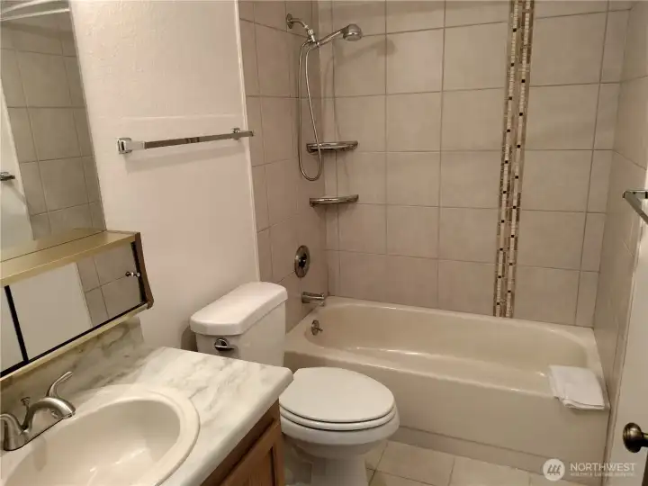 Just down the hallway you will find a full bathroom.