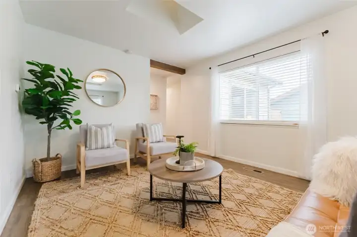 Inviting living room with abundant natural light, durable flooring, and a comfortable layout for everyday living or entertaining.