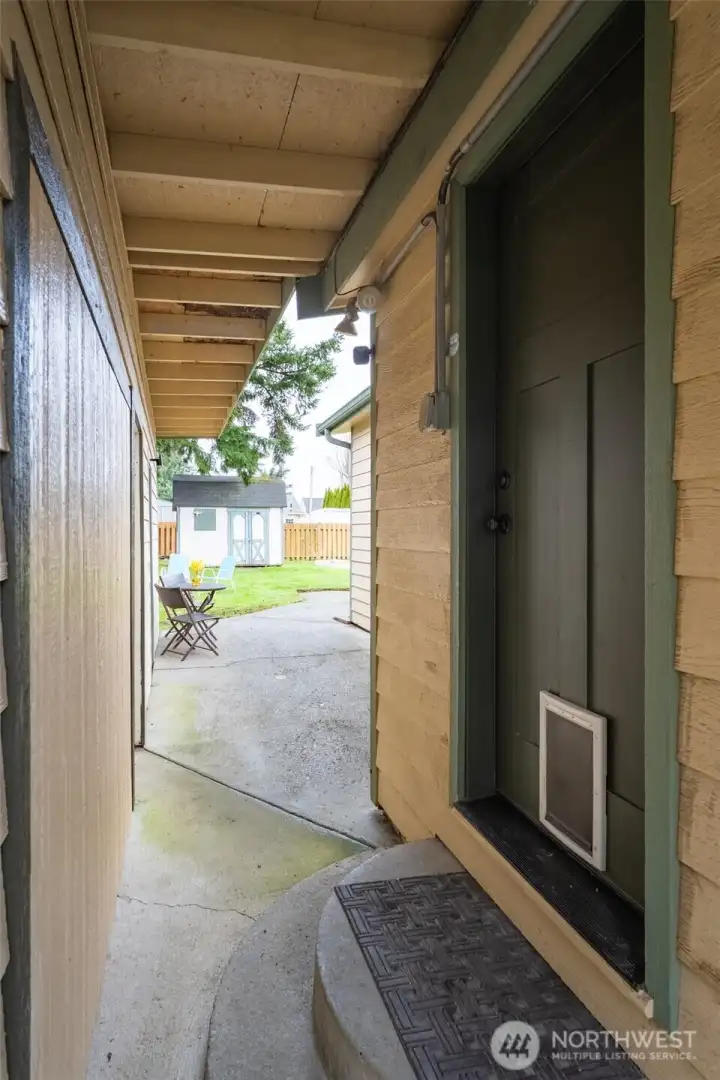 Covered breezeway connects the home to garage and laundry room.