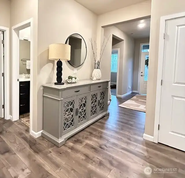 Hallway to Primary and Bedroom 1