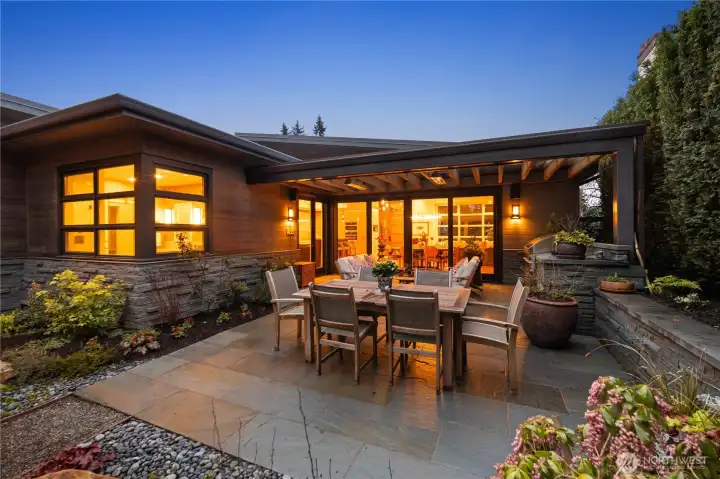 Patio has heaters, built-in BBQ station and is partially covered.