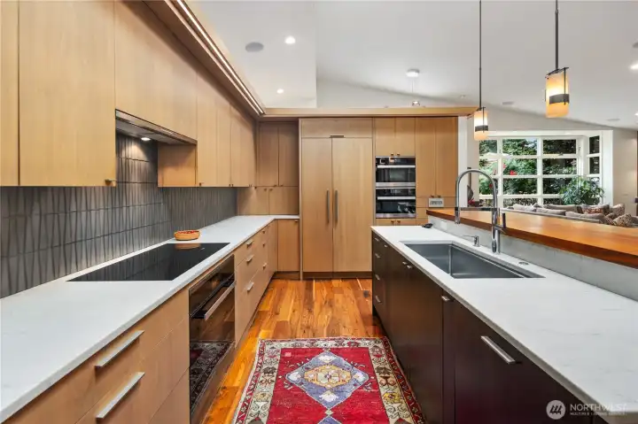 All appliances are Meile.  Notice the huge stainless undermounted sink.  To the left of the refrigerator, is an appliance garage.