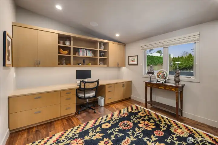 Main floor office with lots of handsome built-in cabinets.  There is a Soji screen door that can close the office off fromt eh hallway.