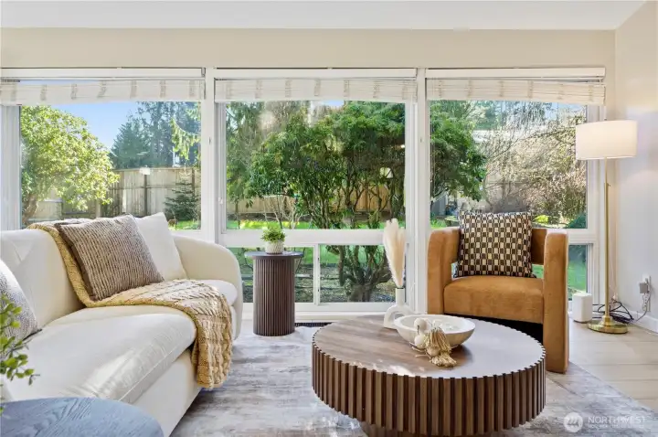 Living room with floor to ceiling windows.