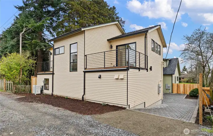 This detached, 2 bed, 1.75 bath home has two second story deck that face the Olympics and the water.