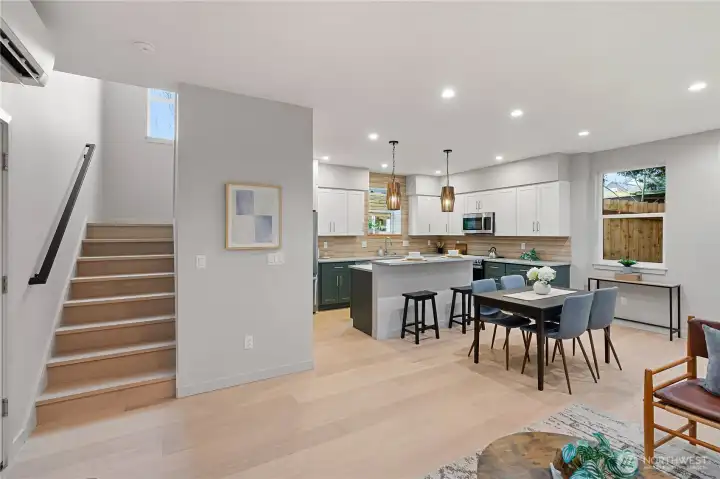 Engineered hardwoods throughout, and mini-splits in the home provide heat and AC.